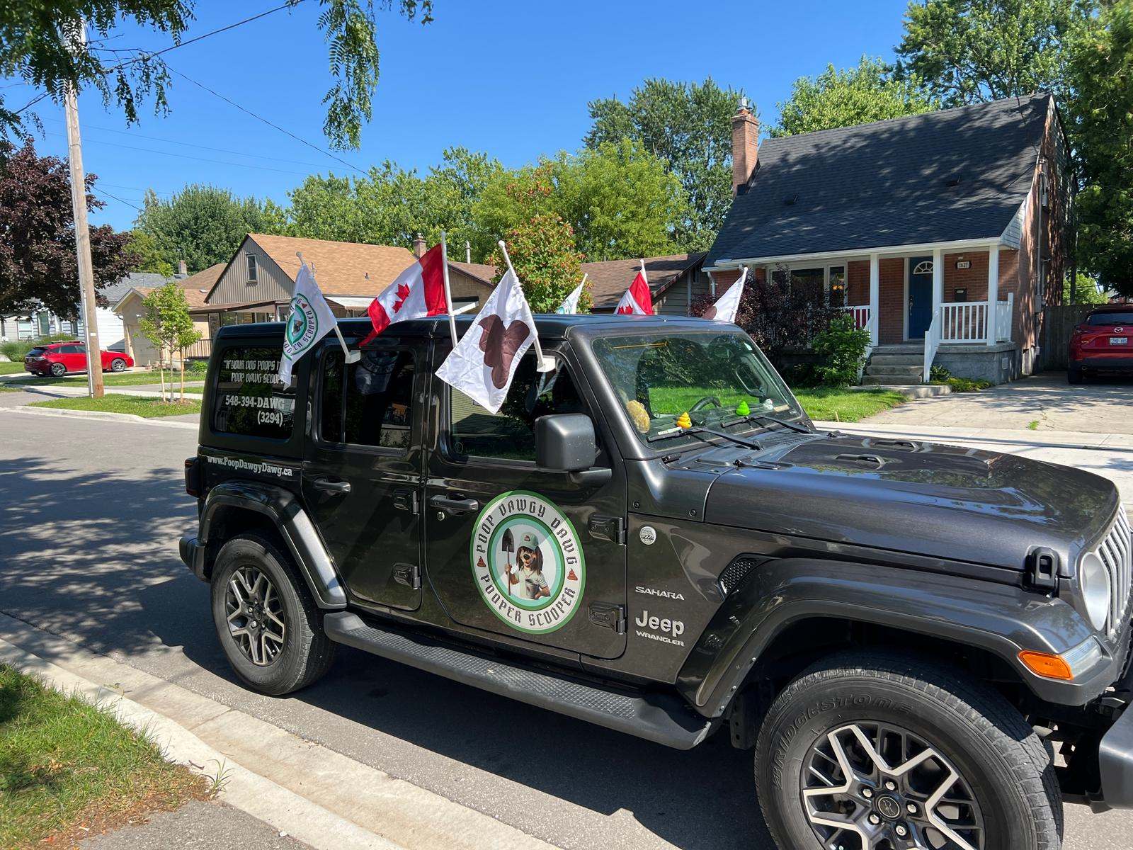 Poop Dawgy Dawg Team in front of their Branded Jeep